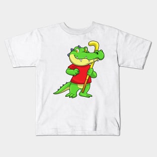 Crocodile at Field hockey with Hockey stick Kids T-Shirt